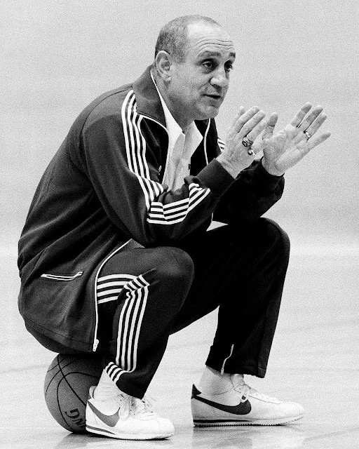 Coach Jerry Tarkanian with basketball players · 4